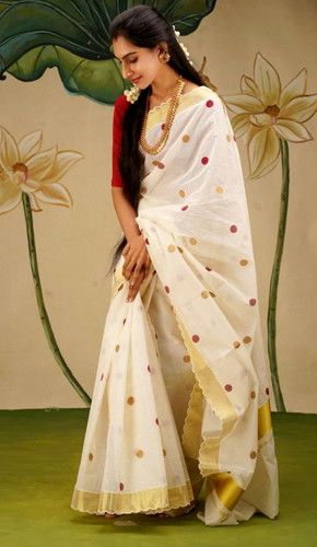 A beautiful kasavu silk saree with a white base and red & yellow polka dots, paired with a plain red long sleeve blouse and gold chain. traditional south indian hairstyle with gajra and minimal makeup. South Saree, South Indian Hairstyle, Kerala Dress, Onam Outfits, Dots Outfit, Kasavu Saree, Different Types Of Dresses, Saree Painting Designs, Saree Painting