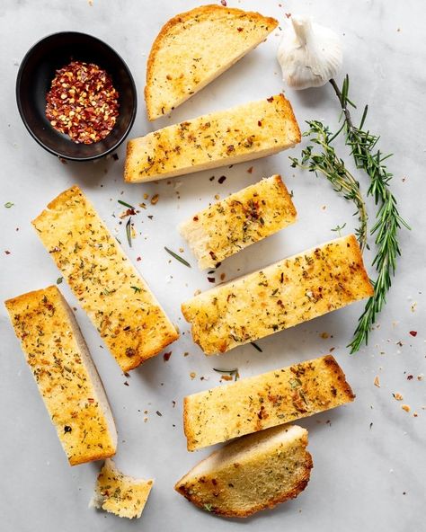 Sharp garlic pairs up with fresh herbs, crushed red pepper, and scads of butter to make the best and easiest garlic bread you’ll ever bring with you to a Memorial Day Party.You know the old meme that goes something along the lines of “if they don’t like BLANK don’t be friends, you don’t need that kind of negativity”? It’s definitely overused at this point, but it’s honestly how I feel about garlic bread. If you don’t like garlic bread, I honestly don’t see how we can be friends. I basi… Bread With Herbs, Frozen Garlic Bread, Italian Dressing Recipes, Memorial Day Party, Fondant Potatoes, Garlic Bread Recipe, Stuffed Jalapenos With Bacon, Finger Sandwiches, Homemade Butter