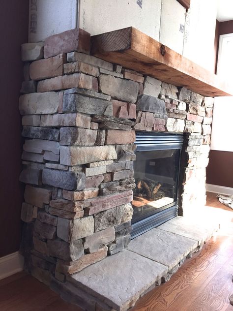 A step-by-step DIY stone veneer installation on a fireplace. In only 4 days, this customer took his fireplace from standard to AMAZING! Diy Stone Veneer, Diy Stone Fireplace, Faux Stone Fireplaces, Stone Veneer Fireplace, Stone Fireplace Designs, Fireplace Facade, Candles In Fireplace, Rock Fireplaces, Stone Facade