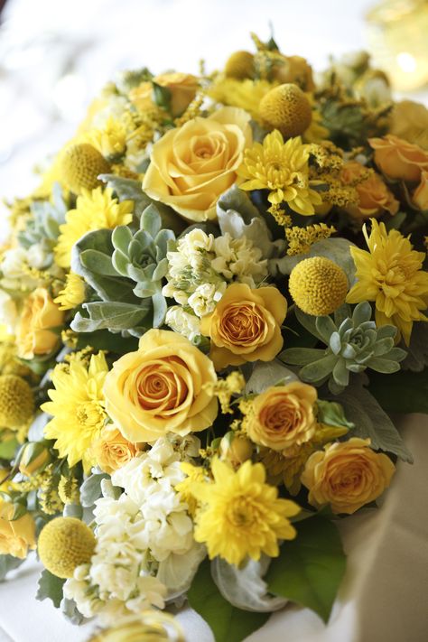 Yellow centerpieces with roses, billy balls, succulents, and other filler flowers. Love! Yellow Roses Decorations, Yellow Roses Centerpieces, Yellow Rose Centerpiece, Yellow Flower Centerpieces, Yellow Wedding Centerpieces, Yellow Rose Wedding, Flower Arrangements For Weddings, Rose Centerpieces Wedding, Yellow Flower Arrangements