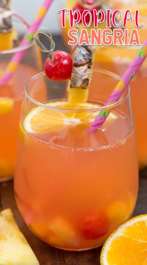 Tropical Sangria Recipe Tropical Sangria Recipe, Tropical Recipes, Tropical Sangria, Alcoholic Recipes, Apple Cider Sangria Recipe, Recipes Pineapple, White Wine Sangria Recipe, Sangria Drink, Cocktails Vodka