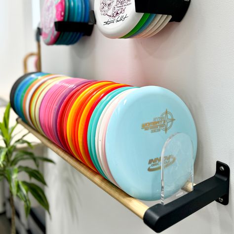 Looking to save space in style? Check out TOUCH's Disc Wall Rack with its slim design that fits perfectly in any room! Disc Golf Shelf, Disc Golf Storage Rack, Disc Golf Gifts Ideas, Disc Golf Storage, Golf Storage, Disc Golf Discs, Kids Room Shelves, Disc Golf Gifts, Golf Room