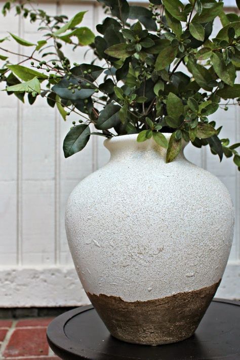 {Knock-Off} Pottery Barn Tuscan Urn.  I gave this a quick coat of spray paint using my go-to Rustoleum Heirloom White. For the textured look, I used Rustoleum American Accent Bleach Stone Spray Paint. Let me just tell you, this stuff is COOL. It really just spits out texture and after a couple coats it's like stone. Neutral Vase, Stone Spray Paint, Pottery Barn Diy, Diy Painted Vases, Bedroom Teal, Barn Living, Old Vases, Pottery Barn Inspired, Rustic Pottery