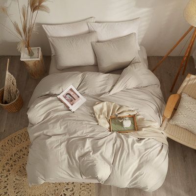 The simple style of the washed cotton duvet set, its material is soft and breathable, and the natural ruffled texture adds a retro atmosphere, providing you with a more relaxed and comfortable lifestyle. The washed cotton duvet set comes in a variety of colors and sizes to complement a variety of home decor styles. Size: Full Duvet Cover + 2 Standard Pillowcases, Color: Beige Tan | Ebern Designs Washed Cotton Duvet Cover Set Cotton in White | Full Duvet Cover + 2 Standard Pillowcases | Wayfair | Cream Sheets Aesthetic, Twin Bed Spread, Tan Bed Set, Western Duvet Covers, Simple Neutral Bedding, Cream Duvet Bedding Ideas, Retro Boho Home Decor, Beige Bedding Aesthetic, Beige Bed Set