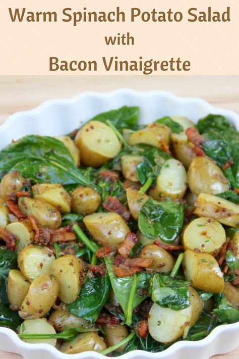 White large bowl of potatoes, spinach and bacon with a dressing on them combining them as a salad. Wilted Spinach Salad With Bacon, Warm Spinach Salad, Spinach And Potato Recipes, Spinach Side Dish, Spinach Potato, Potato Salad With Bacon, Bacon Vinaigrette, Warm Potato Salads, Perfect Salad