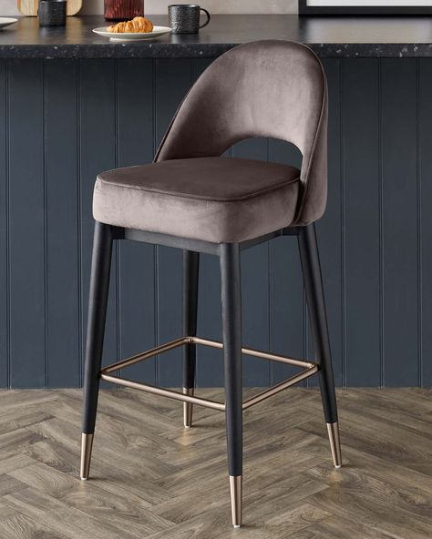 The Clover Mocha Velvet Bar Stool is the perfect addition to your kitchen island or home bar. Upholstered in a sleek mocha brown velvet, the bar stool has brushed bronze capped legs to add an element of luxury. The curved back with the cut out is a nod to mid-century style chairs giving this modern bar stool a timeless look. Urban Rugs, Mid Century Bar Stools, Bar Chairs Kitchen, Luxury Bar Stools, Fabric Bar Stool, Island Chairs, Brown Bar Stools, Velvet Stool, Tiki Bar Decor