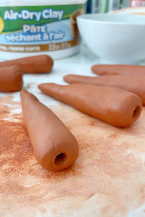 DIY Air Dry Clay Carrots - Create cute mini carrots using air dry terra cotta clay. Perfect addition for spring and Easter vignettes. Spring Clay Craft. Terra Cotta Air Dry Clay, Clay Carrot, Easter Vignettes, Wooden Lanterns Diy, Lanterns Diy, Spring Lantern, Terra Cotta Clay, Mini Carrots, Easter Arrangement