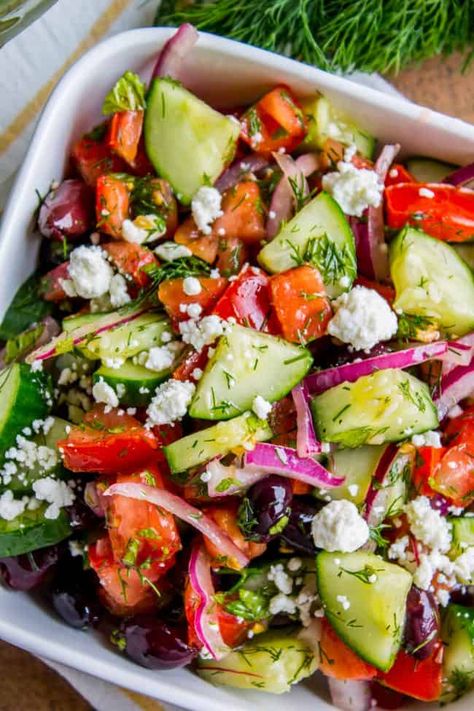 Greek Salad Recipe with Tons of Feta Cheese from The Food Charlatan. This Greek Salad Recipe with Feta is a winner! Fresh cucumbers and tomatoes tossed in a simple vinaigrette, sprinkled with lots of crumbled feta. It's so easy and is the perfect last minute side dish for dinner or summer barbecues. #cucumber #tomato #salad #olive #kalamata #mint #dill #fresh #recipe #dressing #healthy #easy #authentic #feta #oregano #traditional #chopped #classic Greek Goodness, Lettuce Romaine, Cucumbers And Tomatoes, Tomato Cucumber Salad, Salty Recipes, Dressing Healthy, Greek Salad Recipe, Health Lunches, Fresh Recipe