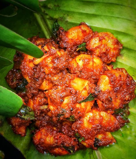 This Nadan Chemmeen Roast is one dish which looks more or less similar to the ones served in a Kallu Shappu(Toddy Shops). Prepared in a typical Kerala style with local spices and undoubtedly fried in Coconut Oil, gives an authentic touch to this Prawn Roast. Prawns are marinated in freshly ground spice paste with a drizzle of Lemon Juice. The finishing touch of this Chemmeen Roast is undoubtedly the Coconut Milk, which elevates the taste and flavour of this Nadan Chemmeen Roast. Chemmeen Roast, Indian Prawn Recipes, Prawns Roast, Prawns Fry, Prawns Recipe, Prawn Dishes, Sense Of Taste, Coconut Milk Recipes, Prawn Recipes