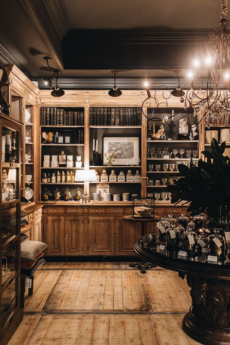 Old Leather Books in Antique Cabinetry by Suzie Anderson Home at Old Bank Atelier Moody Retail Store, Vintage Shop Aesthetic, Academia Interior, Dark Academia Interior, Materials Board, Herbal Shop, Argyle Street, French Boutique, Decor Drawing