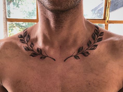 Guys Collar Bone Tattoos, Wreath Around Neck Tattoo, Olympic Leaves Tattoo, Vines Around Neck Tattoo, Plant Chest Tattoo Men, Olive Branch Tattoo Mens Neck, Vines On Collar Bone Tattoo Men, Laurel Wreath Collar Bone Tattoo, Leaf Neck Tattoo Men