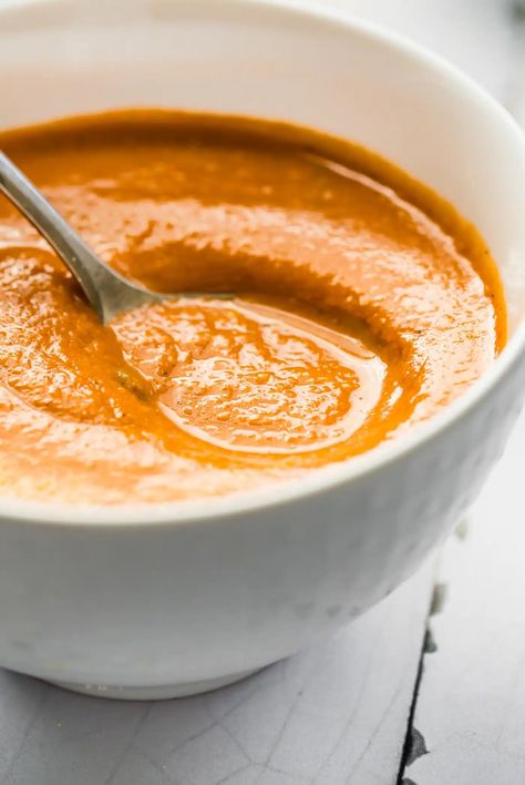 This vegan tomato soup with carrots is an African inspired dairy free bisque. Made with simple wholesome ingredients. Quick to make and paleo. #soup #vegan #tomatosoup #whole30 #dairyfree Whole 30 Tomato Soup, Tomato Soup With Carrots, Tomato Carrot Soup, Dairy Free Tomato Soup, Soup With Carrots, Tomato Basil Bisque, Vegan Tomato Soup, Carrot Soup Recipes, Paleo Soup