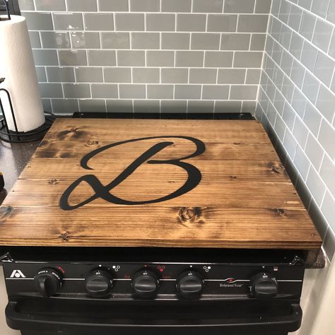 Stove cover #rvremodel #rvreno #rvmakeover #diy #stovetop Rv Noodle Board, Rv Hitch Cover Ideas, Rv Stove Top Cover Diy, Stovetop Cover Designs, Camper Stove Cover Diy, Camper Stove Cover, Seasonal Campsite Ideas, Rv Stove Cover, Barbie Trailer