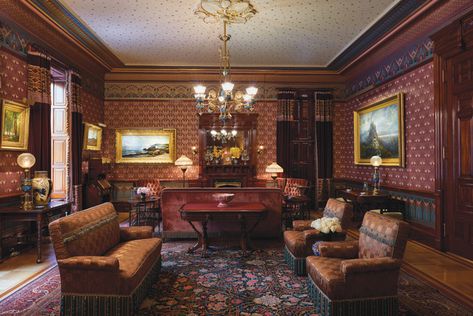 The furniture in this view of the Wigmores’ living room includes a center table designed by architect Frank Furness (1839–1912) and a side table by Herter Brothers. Artwork in the room includes, to the left of the fireplace, Low Tide, Heather­ing­ton’s Cove, Grand Manan Island by Alfred Thompson Bricher (1837–1908), 1899, and, at right, Lake of the Clouds, Mount Mansfield, Vermont by Edmund Darch Lewis (1835–1910), 1869. Arnaud photograph. The Dakota New York, Luxury Apartment Building, Center Table Living Room, Apartment Buildings, New York City Apartment, Luxury Apartment, Apartment Life, New York Apartment, Nyc Apartment