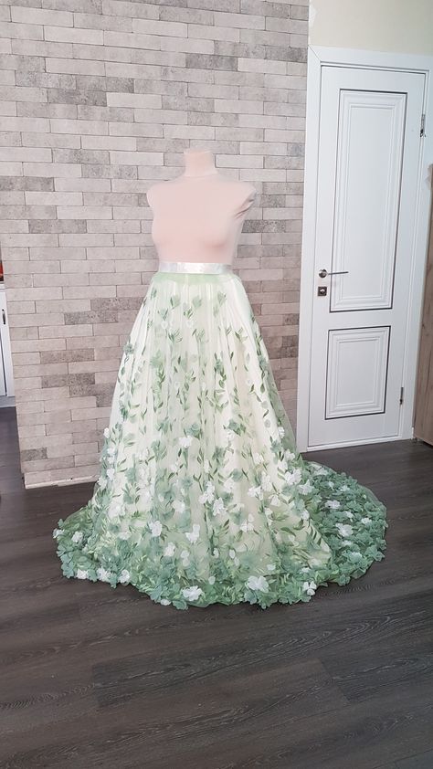 Flower embroidered light green tulle detachable wedding skirt with train - an elegant adding to your wedding gown can be matched with different styles wedding gowns and tops. Also, the skirt can be ordered in full, with Royal satin underneath skirt, Tulle crinoline and Lining. Please select all your preferred options and indicate your size at checkout. Kindly note that this listing is for the skirt presented in the first pictures. In case you are interested to buy one of optional items from the Green And White Gown, Dino Wedding, Detachable Wedding Skirt, Wedding Overskirt, Bridal Skirt Separate, White Flower Wedding, Train Skirt, Wedding Train, Otherworldly Beauty