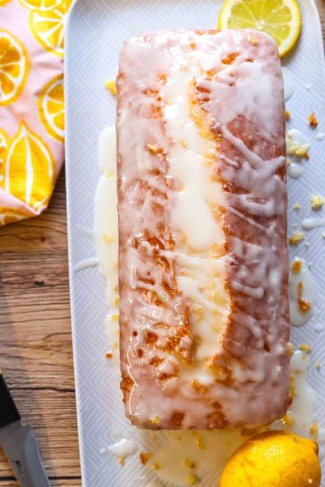 This Lemon Loaf Cake is a lemon lover’s dream and a super easy dessert. This recipe is a breeze to whip up with just a handful of simple ingredients, including a box of cake mix. This refreshing loaf cake is soft, slightly dense, and moist, thanks to the cake mix and pudding mix. The luscious lemon glaze adds a zesty punch to help balance the sweetness. It’s a delicious and easy Easter treat or spring dessert. Easy Lemon Loaf Cake, Easy Lemon Loaf, Easy Lemon Bread, Lemon Loaf Cake Recipe, Cream Bread Recipe, Delicious Lemon Desserts, Lemon Cake Mix Recipe, Lemon Loaf Recipe, Recipes Using Cake Mix