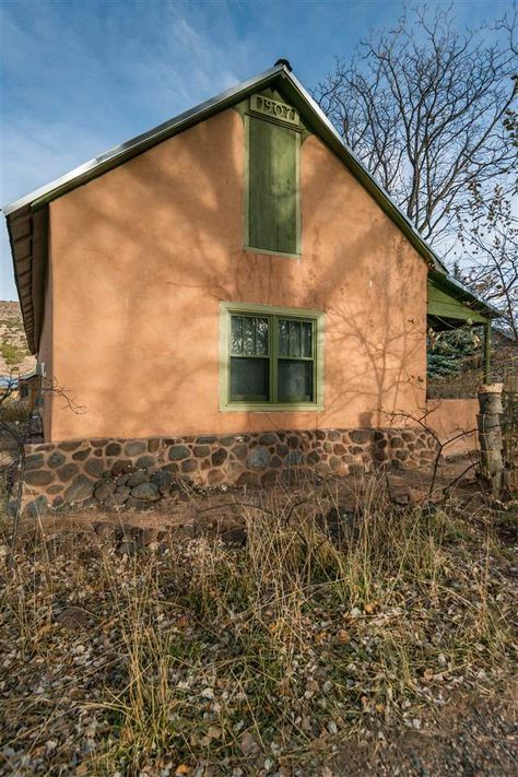 1840 Adobe Farm House, Abiquiu, NM, 87516 MLS #201702881 Garden With Sitting Area, Fireplace With Wood Burning Stove, Adobe Brick, On Demand Water Heater, Brick Floors, Brick Farmhouse, Northern New Mexico, New Mexico Homes, Mexico Real Estate