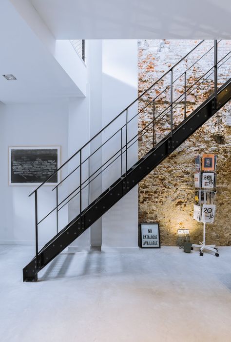 Exposed brick walls work with a black steel staircase and polished concrete floors to give the interiors an edgy and modern atmosphere. Tagged: Staircase, Metal Railing, and Metal Tread.  Photo 6 of 14 in A 19th-Century Dutch Workshop Is Now a Stunning, Spacious Loft from A 19th Century Dutch Workshop Is Now a Stunning, Spacious Loft New Yorker Loft, Diy Staircase, New York Loft, Steel Stairs, Staircase Decor, Industrial Bedroom, Exposed Brick Walls, Stone Walls, Minimal Home