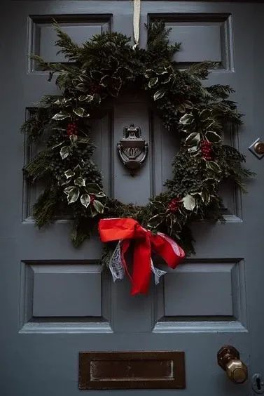 Creating a cozy winter home doesn’t have to be expensive or time-consuming. Your home might feel less warm once the holiday decorations are put away, but don’t fear! You can reflect the beauty of winter by embracing one (or all!) of these ideas: Cozy Winter Home, Holly And Ivy, York Uk, Christmas Front Door, Red Wreath, Holly Wreath, Real Christmas Tree, Christmas Front Doors, Evergreen Plants