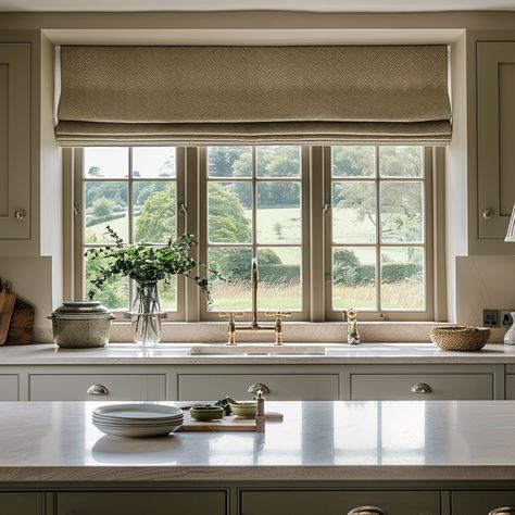 Don't neglect your kitchen windows - adding blinds can add some real personality and warmth. Linen Roman Blinds Kitchen, Cottage Window Blinds, Kitchen Window Roman Shade Over Sink, Farmhouse Kitchen Blinds, Roman Curtains Kitchen, Kitchen Window Blinds Ideas, Roman Blind Kitchen, Window Coverings For Kitchen, Farmhouse Window Treatments Kitchen