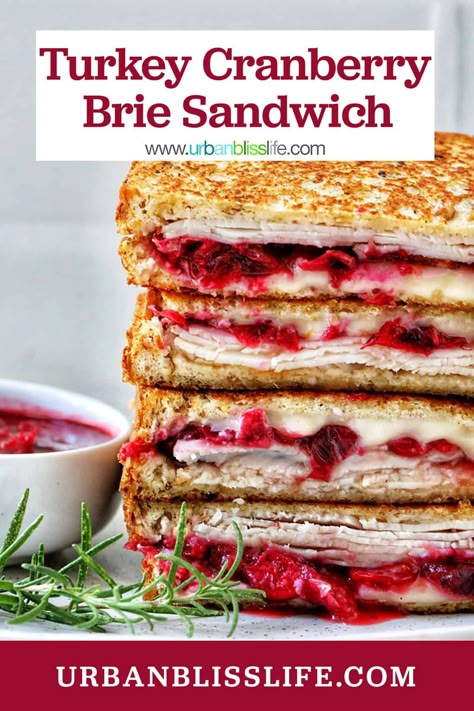 This Turkey Cranberry Brie Sandwich recipe is a great way to use up turkey leftovers around the holiday season. But it's great to make with deli turkey slices, too, all year long! With creamy brie cheese, tart and tangy cranberry sauce, and protein-packed turkey, this is a hearty, satisfying sandwich that's perfect for lunch or dinner. Get the easy recipe at UrbanBlissLife.com. Deli Sliced Turkey Recipes, Turkey Gouda Sandwich, Turkey Brie Cranberry Sandwich, Turkey Brie Sandwich, Turkey Cranberry Sandwich, Brie Sandwich Recipes, Cranberry Turkey Sandwich, Turkey Sandwich Recipes, Brie Tart