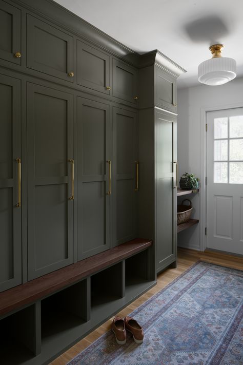 Our goal was to craft a versatile and organized mudroom suitable for a busy family. This space is designed to manage backpacks, shoes, and hang your little ones' treasured artwork. 🖼️ Masculine Mudroom, Bluestone Mudroom, Moody Mudroom, Charcoal Mudroom Cabinets, Navy Blue Mudroom Lockers, Dark Green Mudroom Lockers, Navy Mudroom Lockers, Busy Family, Stone House