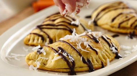 Grands!® Jr. Banana Empanadas Spanish Dessert, Chocolate Covered Banana Bites, Chocolate Fudge Topping, Honey Butter Biscuits, Spanish Desserts, Chocolate Covered Bananas, Pillsbury Recipes, Canned Biscuits, Banana Bites