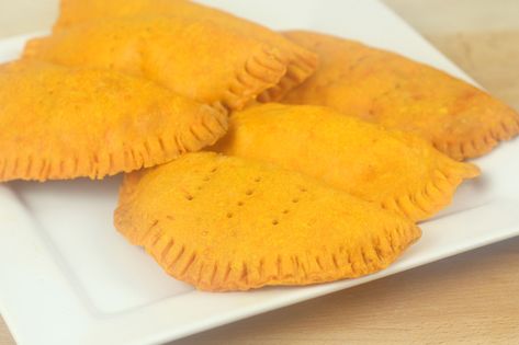 Homemade Jamaican patties recipe. This dish is one of the most famous and likeable Jamaican snacks, as it’s great for on the go and has an even greater taste! Everybody ... Read More Patty Jamaican, Jamaican Patties Recipe, Jamaican Snacks, Coco Bread, 2023 Meals, Jamaican Patties, Beef Patties Recipes, Jamaican Beef Patties, Jamaican Patty