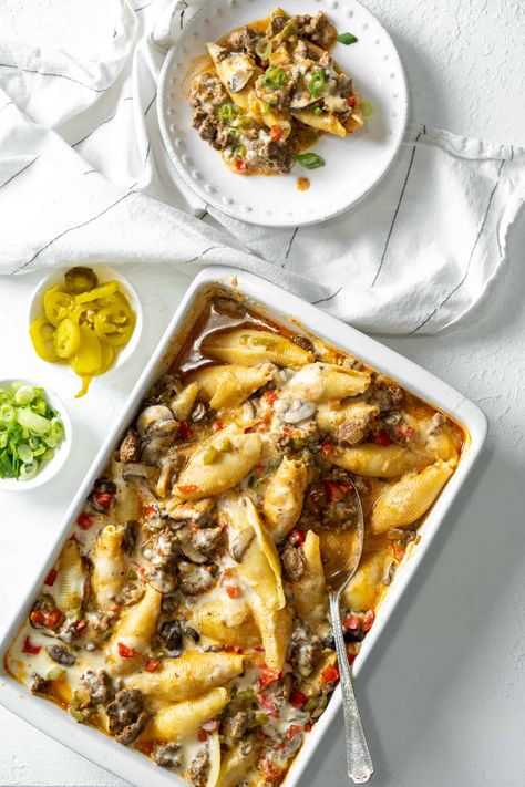 These Philly Cheesesteak Stuffed Shells will be your next family favorite recipe. This dish is loaded with ground beef, mushrooms, bell peppers and a delicious creamy white cheese sauce. Cheesesteak Stuffed Shells, Oh Snap Macros, White Cheese Sauce, Macro Recipes, Shells Recipe, Beef Dinners, Gluten Free Noodles, Macro Friendly Recipes, Stuffed Shells Recipe