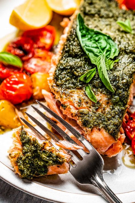 Oven Baked Salmon with Pesto is an extraordinary meal with practically no prep and minimal cleanup! You’ll love this luscious salmon fillet, baked with basil pesto and ripe tomatoes.