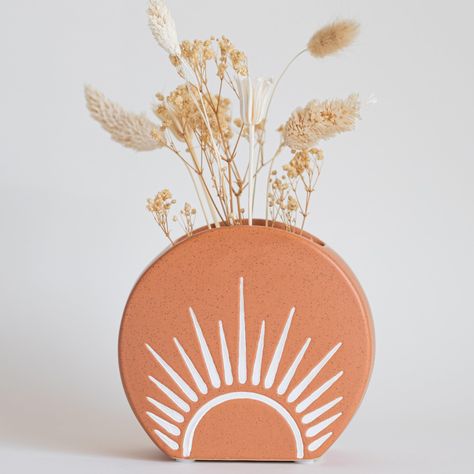 PRICES MAY VARY. Unique Vase with sun rays etched design. Funky and eclectic decoration sure to brighten up, and add color to any space. Holds pampas grass, fresh floral arrangements, small plants, and succulents Modern boho home decor. Elegant vase for dried florals to adorn the living room, shelf, dining, or table. Use as a pen holder on a desk, makeup brushes on a bathroom vanity, or hold incense or candles Drainage hole with removable plug, a great planting alternative to regular flower pots Eclectic Decoration, Cute Vintage Aesthetic, Small Flower Vases, Boho Centerpiece, Sun Decor, Modern Boho Home Decor, Desk Makeup, Elegant Vase, Room Shelf