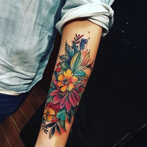 This beautiful forearm tattoo bursts with color and life, featuring a vibrant arrangement of flowers and leaves that create a stunning display of nature's Tattoos On Forearm For Women, Flowers Tattoo Forearm, Tattoos On Forearm, Bird Tattoos For Women, Anatomical Heart Tattoo, Cute Cat Tattoo, Tattoo Forearm, Foot Tattoos For Women, Forearm Tattoo Design