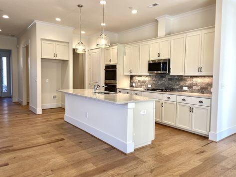 How to Create a Warm White Kitchen - Niblock Homes Kitchen Flooring Ideas With Maple Cabinets, Kitchen Floor White Cabinets, White Kitchen Light Wood Floors, How To Warm Up A White Kitchen, Kitchen Ideas Classic, Warm White Kitchen, Taupe Flooring, White Kitchen Wood Floors, Adu Ideas