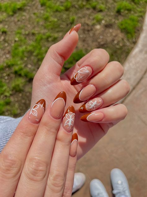 Almond nails with brown french tips and white butterflies Almond Nails With Butterflies, Cute Brown French Tip Nails, French Tips With Butterflies, Butterfly Almond Nails, White Butterfly Nails, Brown French Tips, Brown French Tip Nails, Brown French Tip, Short French Tip Nails