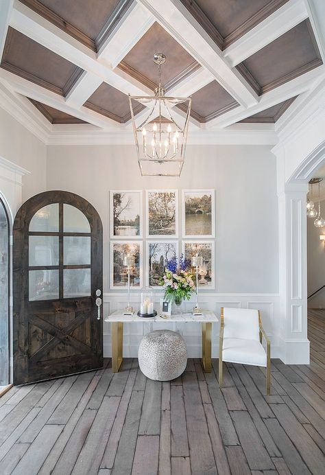 Transitional entry with a lovely little picture wall [From: Chelsea Kasch / Nick Bayless Photography] Transitional Entry, Arched Front Door, Entry Lighting, Farmhouse Side Table, Foyer Entryway, Ceiling Treatments, Dark Wood Floors, Rug Ideas, Wooden Ceilings