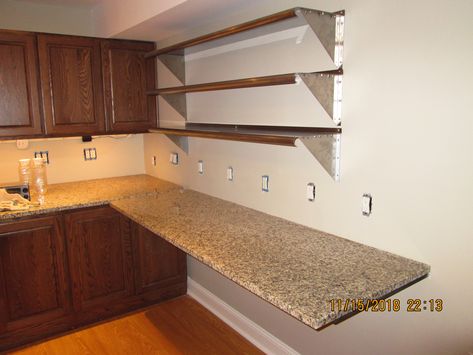 Kitchenette with 25” by 76” wall hung granite countertop. Heavy steel 27” in-wall free hanging shelf brackets from The Original Granite Brackets company. Used cabinets and granite from Craigslist. Granite Kitchen Counters, Used Cabinets, Wall Shelf Brackets, Granite Kitchen, Kitchen Wallpaper, Break Room, Shelf Brackets, Hanging Shelves, Base Cabinets