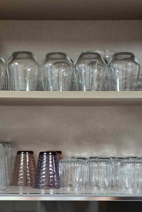 Pro cleaning experts share the benefits and disadvantages of storing glassware upside down in the kitchen cabinet. #glass #kitchen #declutter #declutterideas #homeorganization #howtoclean #organizationtips #realsimple #thespruce Storing Glassware, Kitchen Declutter, Easy Home Organization, Cabinet Glass, Small Closets, Cleaning Guide, Clever Storage, Laundry Hacks, Glass Kitchen