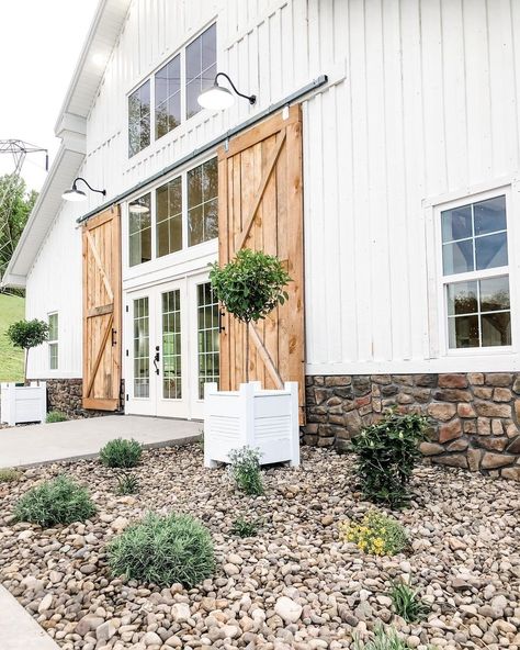 Barn Front Door Entrance, Wedding Venue Design Plans, Barndominium Entrance, White Barn Wedding Venue Ideas, Barn Hangout Ideas, Barn Renovation Ideas, Pole Barn Wedding Venues, Barn Landscaping Ideas, Venue Landscaping