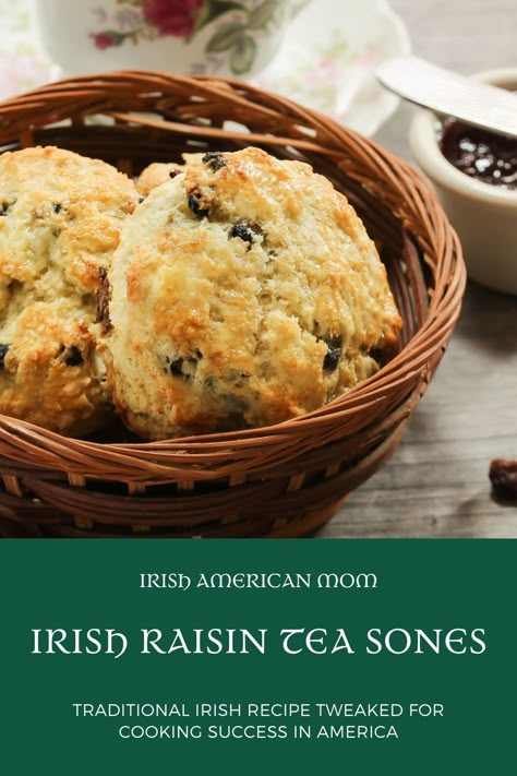 A basket with raisin scones beside a china cup and a ramekin of jam and all over a green text banner Traditional Irish Breakfast Recipes, Irish Scones Recipe Ireland, Irish Soda Scones, Irish Tea Brack Recipe, Irish Raisin Scones, Irish Soda Scones Martha Stewart, Tea Scones Recipe, Irish Scones Recipe, Irish Scones