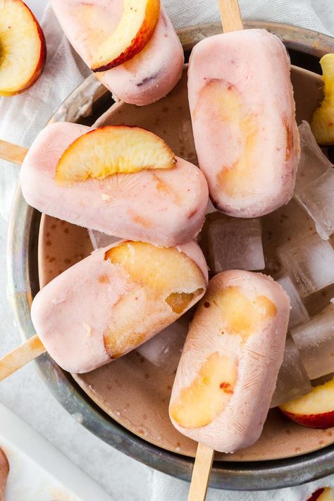 These Homemade Creamy Peach Popsicles are what Summer's all about. Fresh peaches blended with honey sweetened yogurt and frozen to create a flavourful, refreshing and delicious frozen treat. Plum Ice Cream, Peach Popsicles, Frozen Popsicles, Frozen Treats Recipes, Summer Popsicles, Peach Ice Cream, Full Fat Yogurt, Ice Cream Pops, Fruit Dessert Recipes