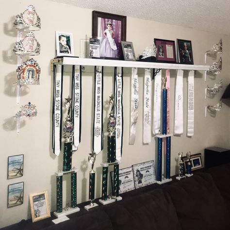 Pageant Crown and Sash Display using shelf brackets Pageant Sash Display, Crown And Sash Display, Dance Awards Display Ideas, Crown Display Ideas, Pageant Room, Pageant Crown Display Ideas, Jackie Sullivan, Awards Display, Pageant Aesthetic