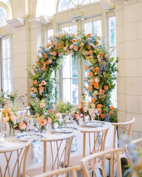 A tablescape that’s all about elegance, charm and color! The perfect blend of vibrant florals, delicate blue china and soft candlelight makes this setting a dream come true for a couple who values attention to detail. Every element is carefully curated to create an atmosphere of timeless luxury and romance. At Alinato Events, we believe your wedding should be a true reflection of your style, and this tablescape captures that essence beautifully. #weddingtablescape #weddingtable #weddingre... Bridgerton Event, Colorful Wedding Decor, Bridgerton Wedding, Vibrant Florals, Wedding Planning Services, Coffeehouse, Timeless Luxury, Colorful Wedding, Wedding Event Planner