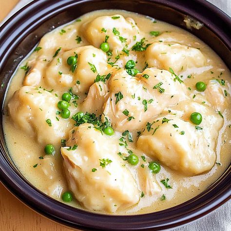 Discover a simple recipe for slow cooker chicken and dumplings with tender chicken, fluffy dumplings, and a creamy broth. Perfect comfort... Crock Pot Chicken And Dumplings, Slow Cooker Chicken Dumplings, Slow Cooker Chicken And Dumplings, Fluffy Dumplings, Chicken Dumpling, Chicken Dumpling Soup, Slow Cooker Creamy Chicken, Easy Slow Cooker Chicken, Dumplings For Soup