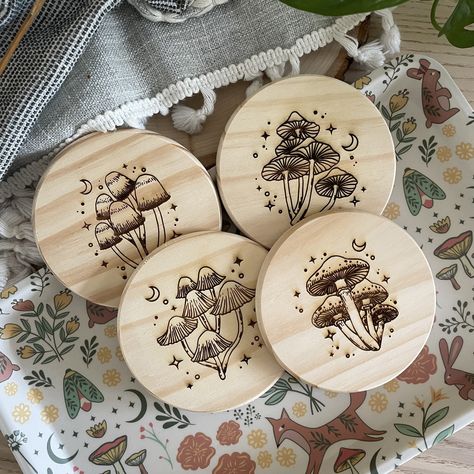 "Our Magic Mushroom Coasters are engraved on 4X4 pine wood, 0.35 inches thick. They are unfinished for a more rustic, unpolished, natural look and feel.  These are the perfect gift and addition to any mushroom lover, and lovers of the magic, the mystical, the witchy, and the psychedelic. They are also available on cork and walnut wood for different finished and styles.  Unfinished Pine Wood Coaster: -4\" Diameter Coasters -0.35\" Thick Coasters  -Handcrafted in Orlando Dark Walnut Wood Coaster: -4\" Diameter Coasters -0.6\" Thick Coasters  Natural Cork Coaster: -3.5\" Diameter Coasters -0.13\" Thick Coasters  Customization Looking to customized your Magic Mushroom Coasters? Send us a message and let us know how we can help!" Wood Burning Mushrooms, Woodburned Gifts, Wood Burning Coasters, Mushroom Coaster, Engraved Wood Coasters, Twin Flame Art, Motivational Art Prints, Wood Burn Designs, Flame Art