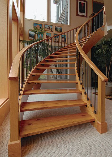 Freestanding curved stairs are a masterful display of building prowess. After St. Louis builder Joe Hawkins built a set of these stairs for a client, he decided to use the lessons he learned to build a set for his own home. In this "Master Carpenter" article, Hawkins details the process he used for building the curved stairs, starting with drawing the stairs on the floor, then building curved temporary stud walls, laminating stringers, and installing the handrails and balusters. Stairs Canopy, Curved Stairs, Cantilever Stairs, Stairs And Doors, Rustic Stairs, Circular Stairs, Wooden Staircase, Stairs Stringer, House Staircase