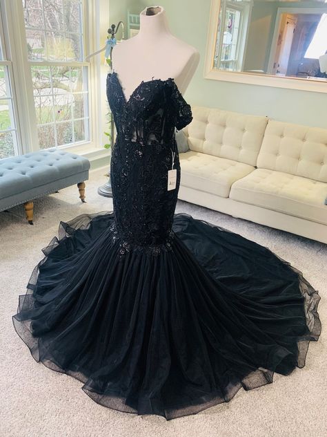 This gorgeous Custom Black Mermaid Wedding Dress with a sweetheart neckline is a total stunner! It includes off shoulder sleeves, a structured see through bodice with bonings, layers of tulle on the train and beautifully dispersed lace all over. It can be custom made in any size and color preference. Follow us on Instagram to see its video! @bridesandtailor Black Mermaid Wedding Dress, Wedding Dress Illusion Back, Black Lace Wedding Dress, Black Wedding Dress Gothic, Black Lace Wedding, Black Wedding Dress, Purple Wedding Dress, Gothic Wedding Dress, Trumpet Wedding Dress