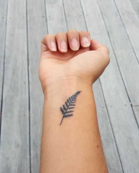 New Zealand Fern Tattoo, Small Fern Tattoo, Meaningful Wrist Tattoos For Women, New Zealand Tattoo Ideas, Meanful Tattoos, New Zealand Fern, Wrist Tattoos Words, Cross Tattoo On Wrist, Wrist Tattoos Girls