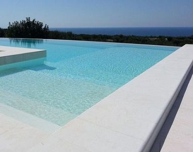 capri white limestone bulnose poo coping tiles and pavers, white pavers, outdoor pavers by stone pavers Pool Limestone Pavers, White Swimming Pool Tiles, Bullnose Coping Around Pool, White Tiled Pool, Outdoor Pool Tiles, White Pool Area, Limestone Pool Paving, Limestone Pool Coping, White Tile Pool