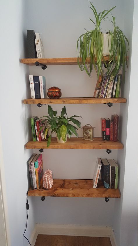 Housewarming reclaimed wood floating shelves on metal brackets with hidden fixings that make it look like the metal pins are just pointing out of the wall and the planks are freely laid on them. Book ends are covered when filled with books so it leaving a gap on each side which looks natural for a rustic style and could be a great solution for uneven alcoves. Alcove Shelves With Brackets, Floating Shelves In Alcove, Floating Bookshelves Bedroom, Bedroom Floating Shelves, Alcove Shelves, Alcove Shelving, Floating Shelves Bedroom, Reclaimed Wood Floating Shelves, Floating Bookshelves