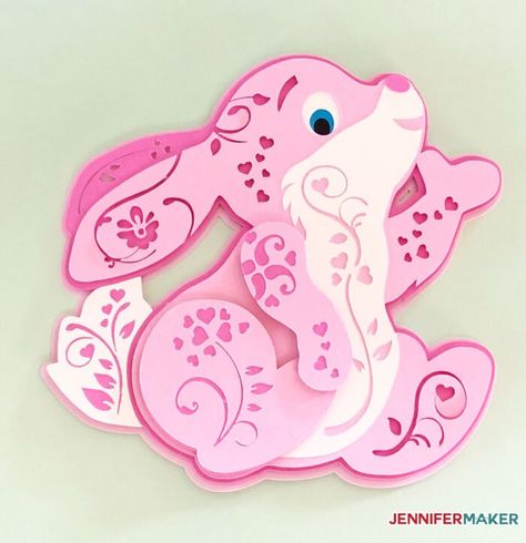 Pink paper bunny in a 3D filigree style 3d Cardstock Projects Cricut, Easter Circuit Projects, 3d Paper Crafts Templates Free Printable, Cricut Easter Cards, 3d Cricut Projects Free, Paper Craft Aesthetic, Easter Cricut Projects, Easter Cricut, Cricut Paper Crafts